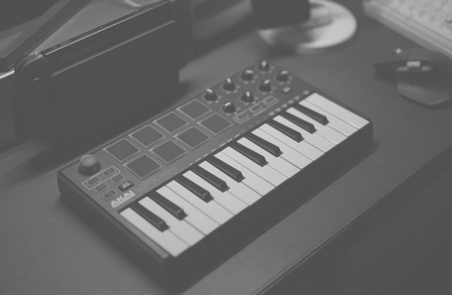 Music production setup with professional equipment and computer workstation